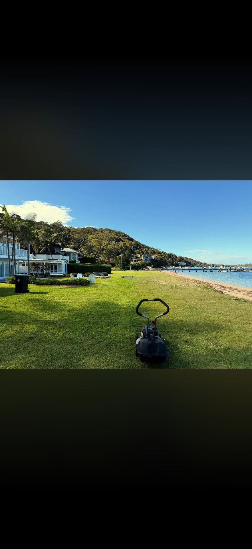Waterfront lawn maintained by Waterhouse Landscapes